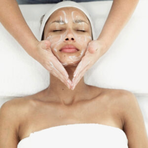 a client at The Skin Clinics getting a facial