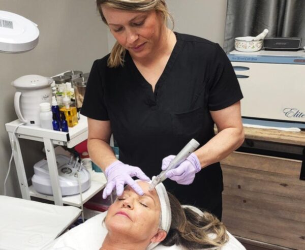 a client receiving a microneedling treatment from one of The Skin Clinics' estheticians