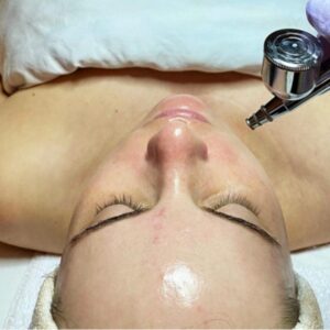 a client at The Skin Clinics getting a rejuvenating facial