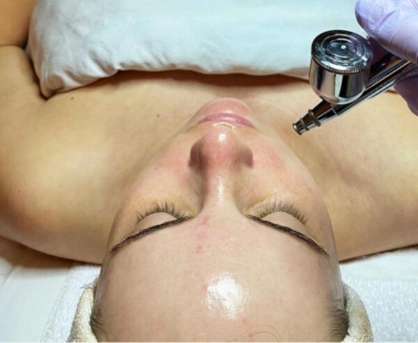 a client at The Skin Clinics getting a rejuvenating facial